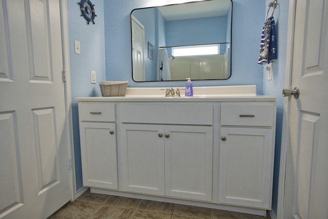 bathroom featuring vanity and tile patterned flooring