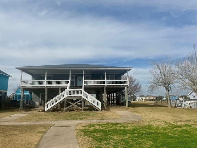 view of front of home featuring a front yard and covered porch