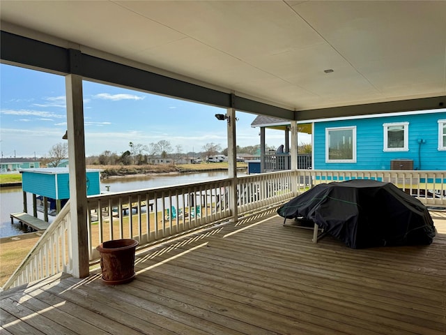 wooden terrace with a water view