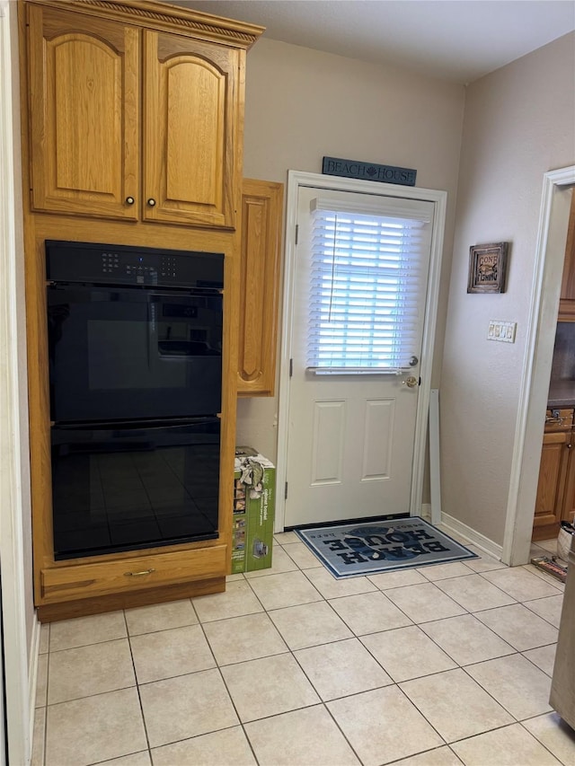 entryway featuring light tile patterned floors