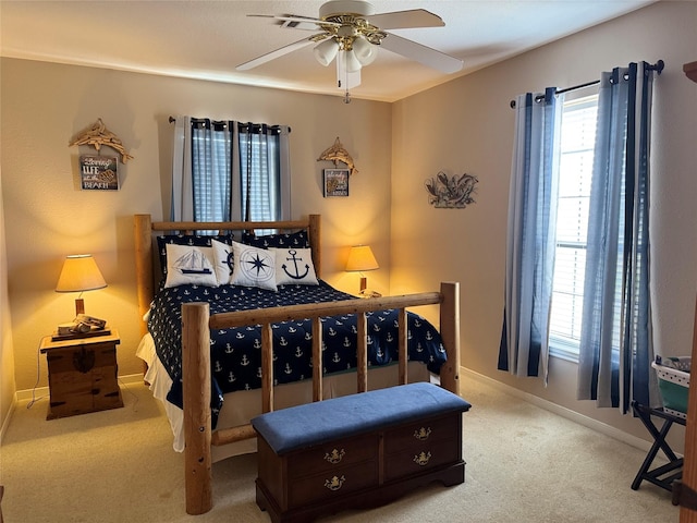 bedroom with light colored carpet and ceiling fan