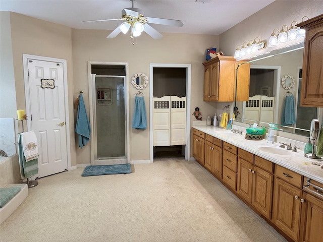 bathroom featuring vanity, a shower with door, and ceiling fan