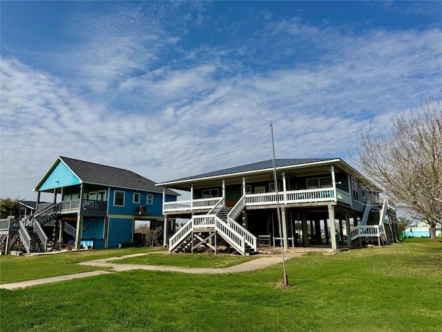 rear view of property with a yard