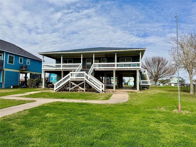 rear view of house featuring a lawn