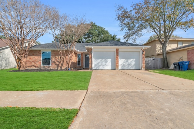 ranch-style home with a garage and a front yard