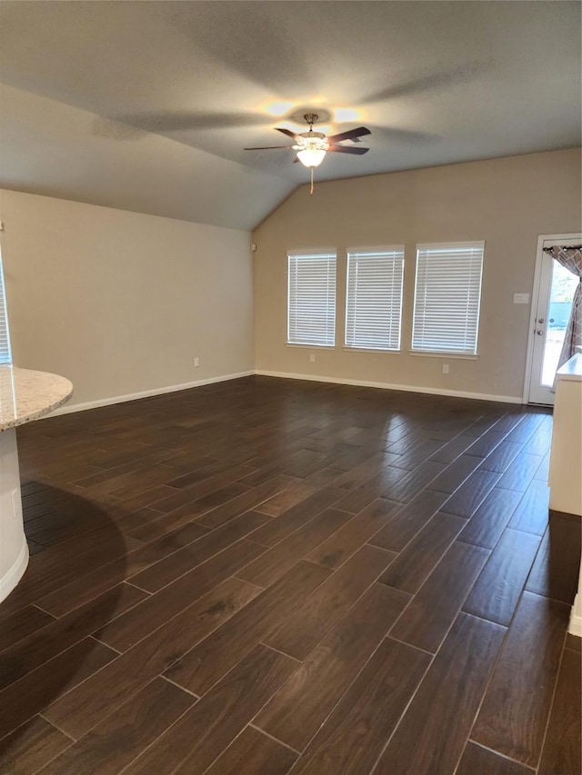 unfurnished room with vaulted ceiling and ceiling fan