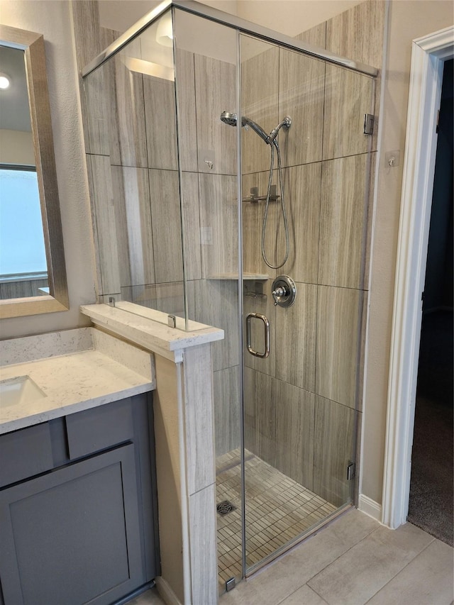 bathroom with vanity and an enclosed shower