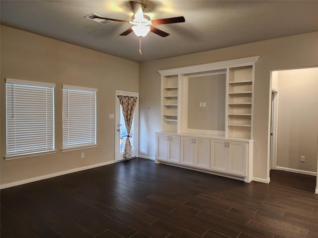 unfurnished living room featuring dark hardwood / wood-style floors and ceiling fan