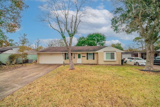 ranch-style home featuring a garage and a front yard