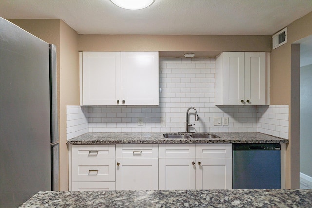 kitchen with stone countertops, appliances with stainless steel finishes, sink, and white cabinets