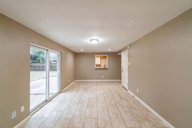 spare room with light hardwood / wood-style flooring