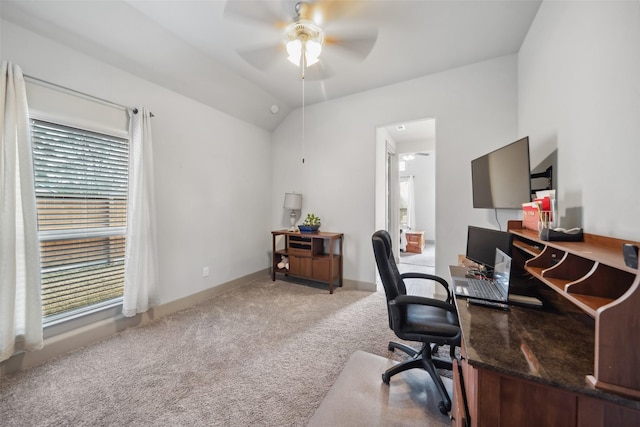 office space with baseboards, carpet flooring, a ceiling fan, and lofted ceiling