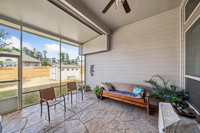 sunroom with a wealth of natural light and ceiling fan