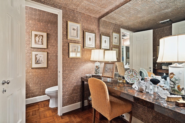 home office featuring dark parquet floors