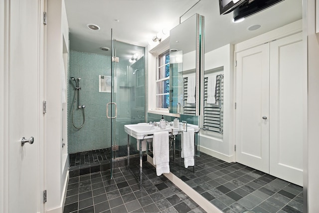 bathroom featuring an enclosed shower and tile patterned flooring