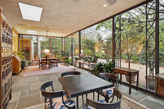 sunroom / solarium featuring a skylight