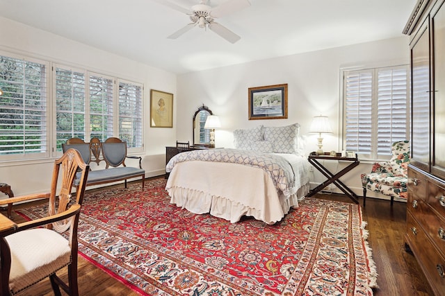 bedroom with dark wood-type flooring and ceiling fan