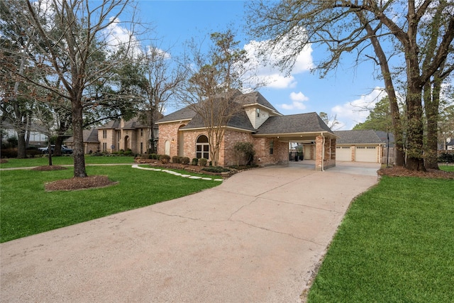 view of front of property with a garage, a front lawn, and a carport