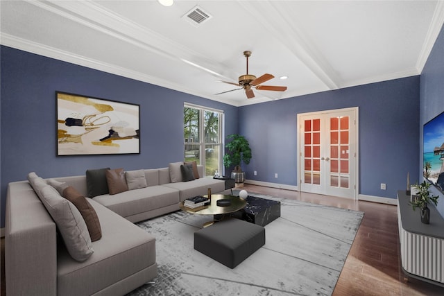 living room with french doors, ornamental molding, ceiling fan, beam ceiling, and hardwood / wood-style floors