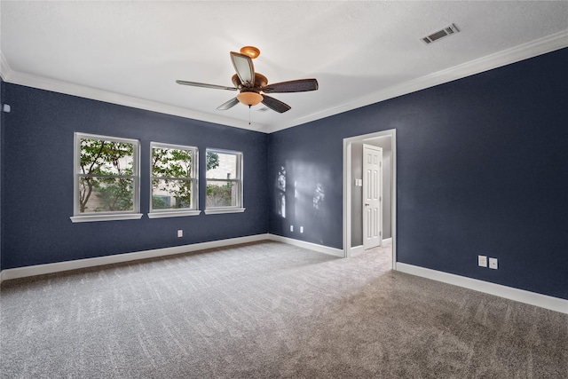 carpeted empty room featuring ceiling fan and ornamental molding