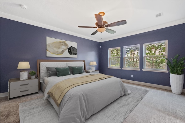 bedroom featuring crown molding, light carpet, and ceiling fan