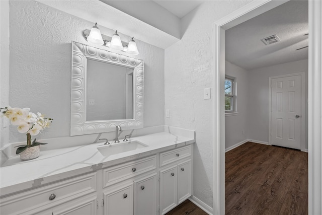 bathroom featuring vanity and hardwood / wood-style flooring