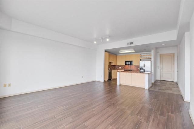 unfurnished living room with hardwood / wood-style floors