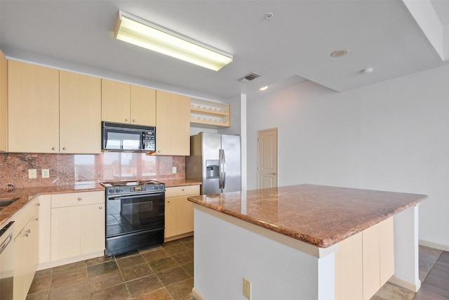 kitchen with backsplash, a center island, light brown cabinets, and black appliances