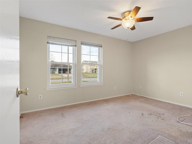 carpeted empty room with ceiling fan