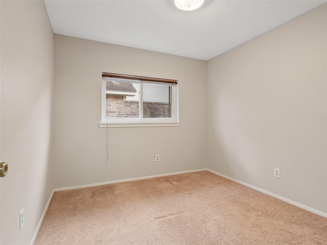 spare room featuring carpet flooring