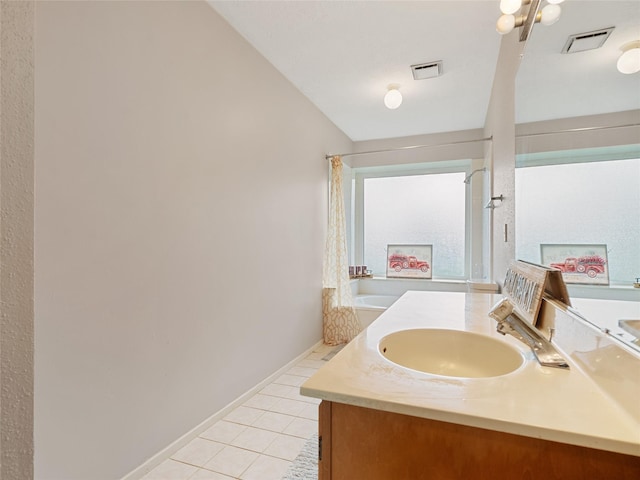 bathroom featuring vanity, shower / washtub combination, and tile patterned flooring