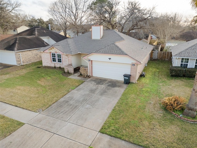 view of front of property with a garage and a front yard