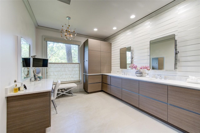 full bathroom with a notable chandelier, ornamental molding, a sink, recessed lighting, and double vanity