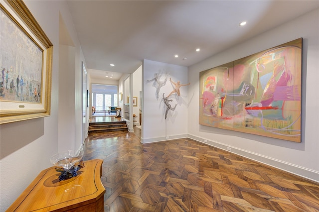 hallway with dark parquet floors