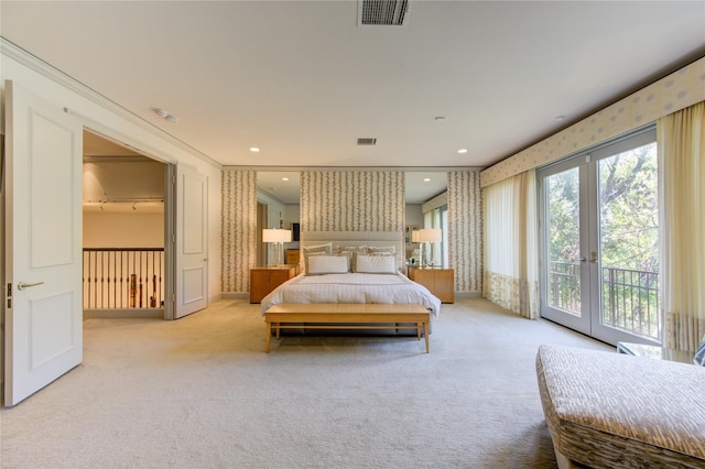 bedroom with wallpapered walls, access to exterior, visible vents, and light carpet