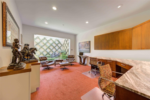 office with recessed lighting, light colored carpet, and built in desk