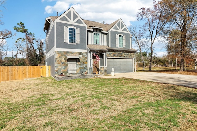 view of front facade with a garage and a front lawn