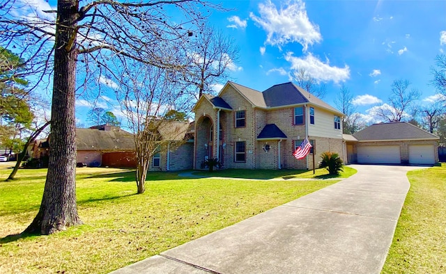 view of front of home with a garage and a front lawn