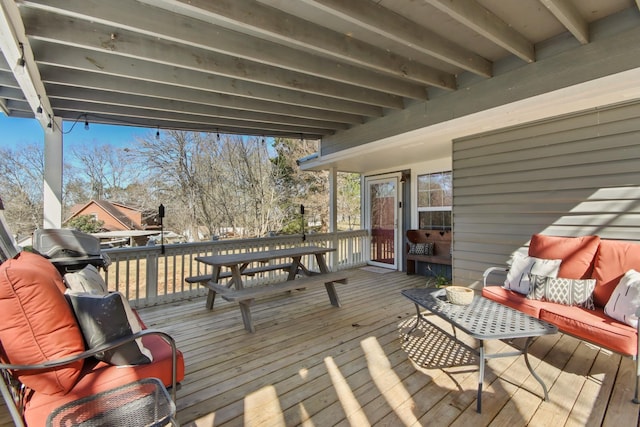 wooden deck with an outdoor living space