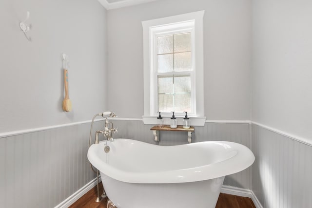 bathroom featuring hardwood / wood-style flooring and a bathing tub