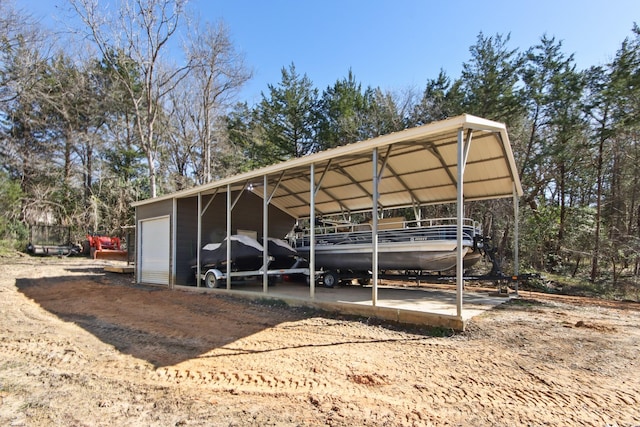 view of parking / parking lot featuring a garage and a carport