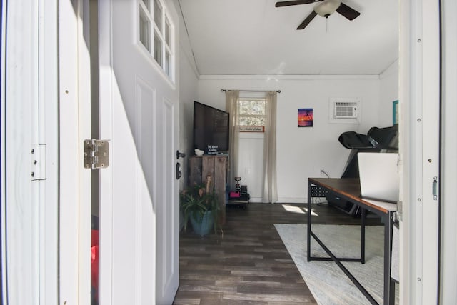 interior space featuring ceiling fan, dark hardwood / wood-style floors, and an AC wall unit