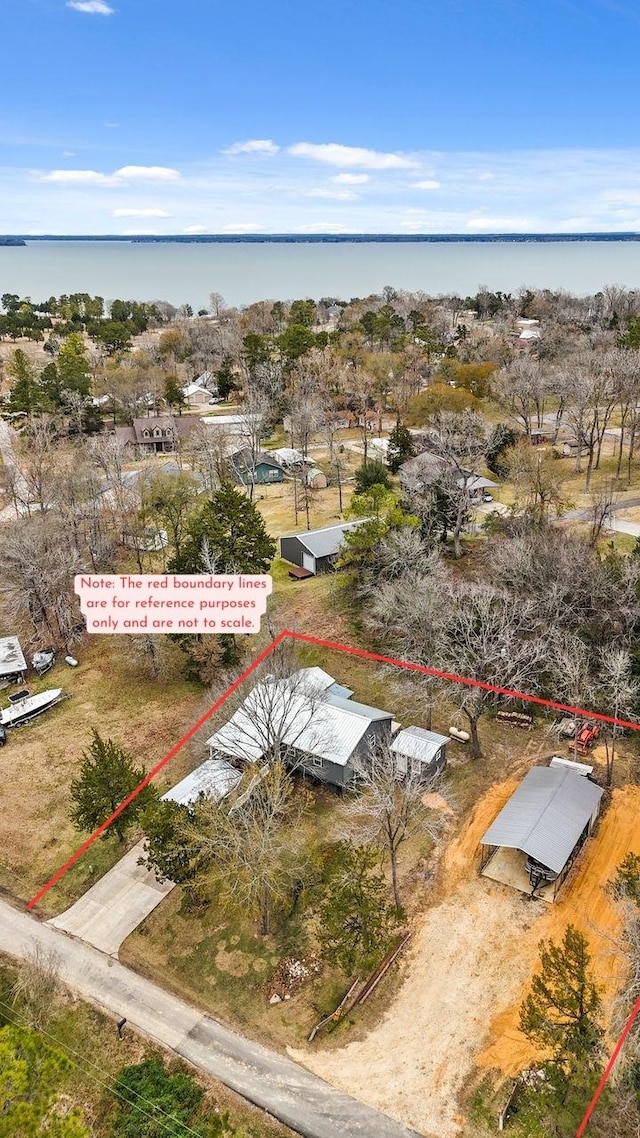 birds eye view of property featuring a water view