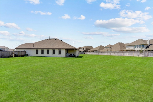 view of yard with central AC