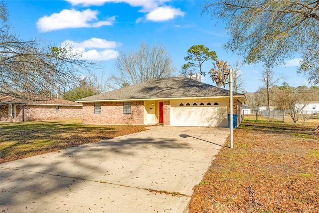 ranch-style house featuring a garage and a front yard