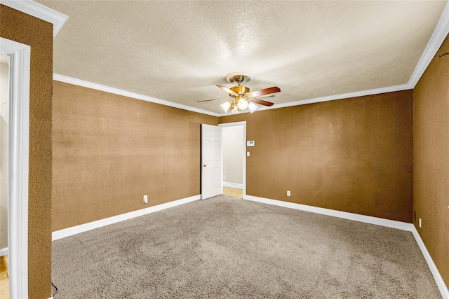 carpeted empty room featuring crown molding, ceiling fan, and a textured ceiling