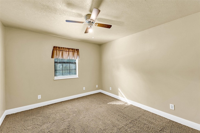 carpeted empty room with a textured ceiling and ceiling fan