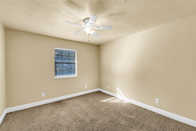 carpeted empty room featuring a textured ceiling and ceiling fan