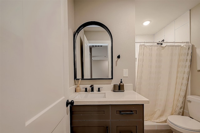 bathroom featuring vanity, a shower with curtain, and toilet