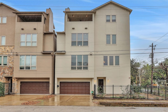 multi unit property featuring a garage